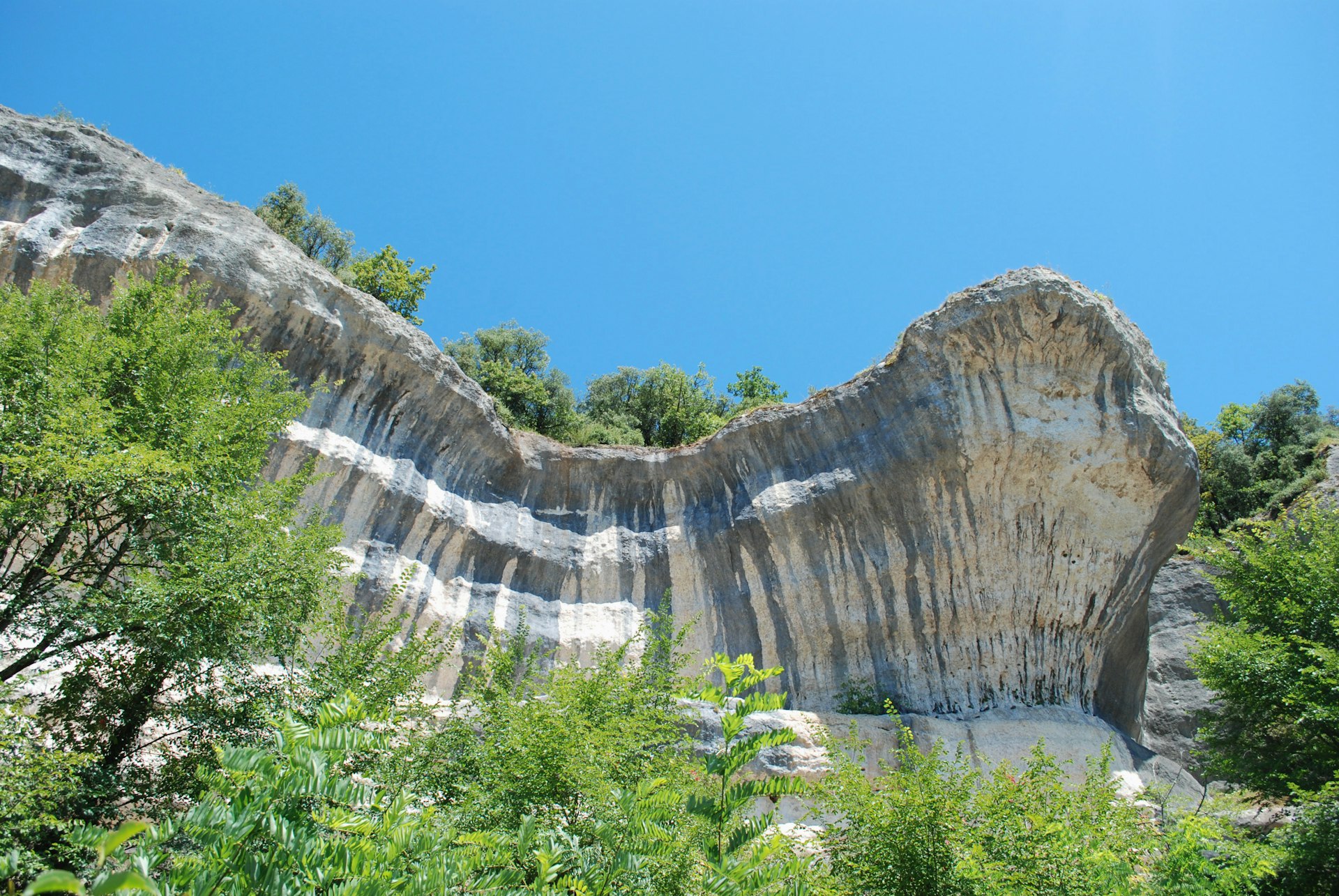 brown rocky mountain under blue sky during daytime